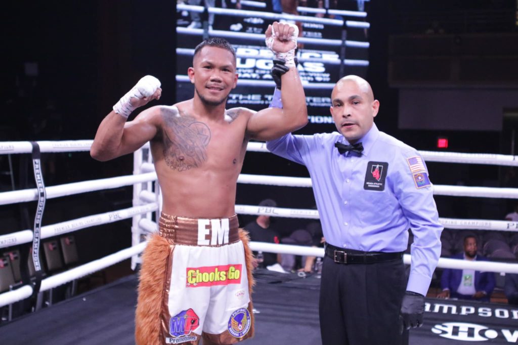 MARCIAL WINS BY TKO. Referee Raul Caiz Jr. raises the hand of Eumir Marcial after the latter won a fourth round TKO against Isaiah Hart. | Photo from Marcial's Facebook page.