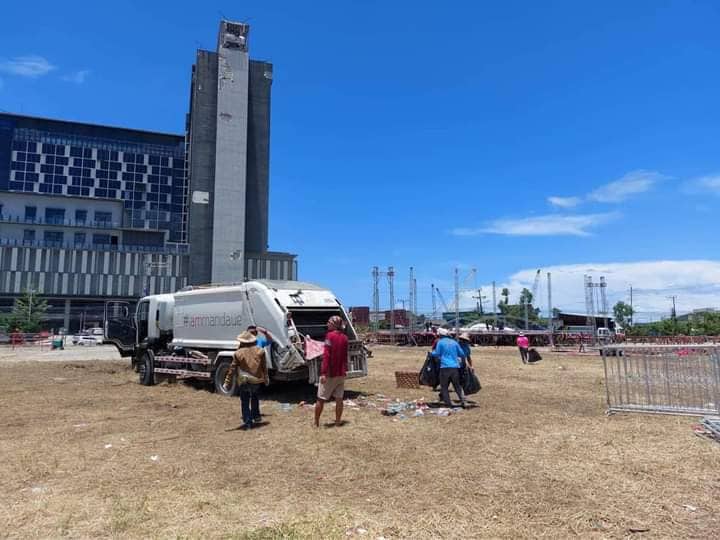 Personnel from the Department of General Services of the Mandaue City government load the remaining trash after the day's cleanup of the Ceboom! rally venue, a day after the event. | Mandaue PIO