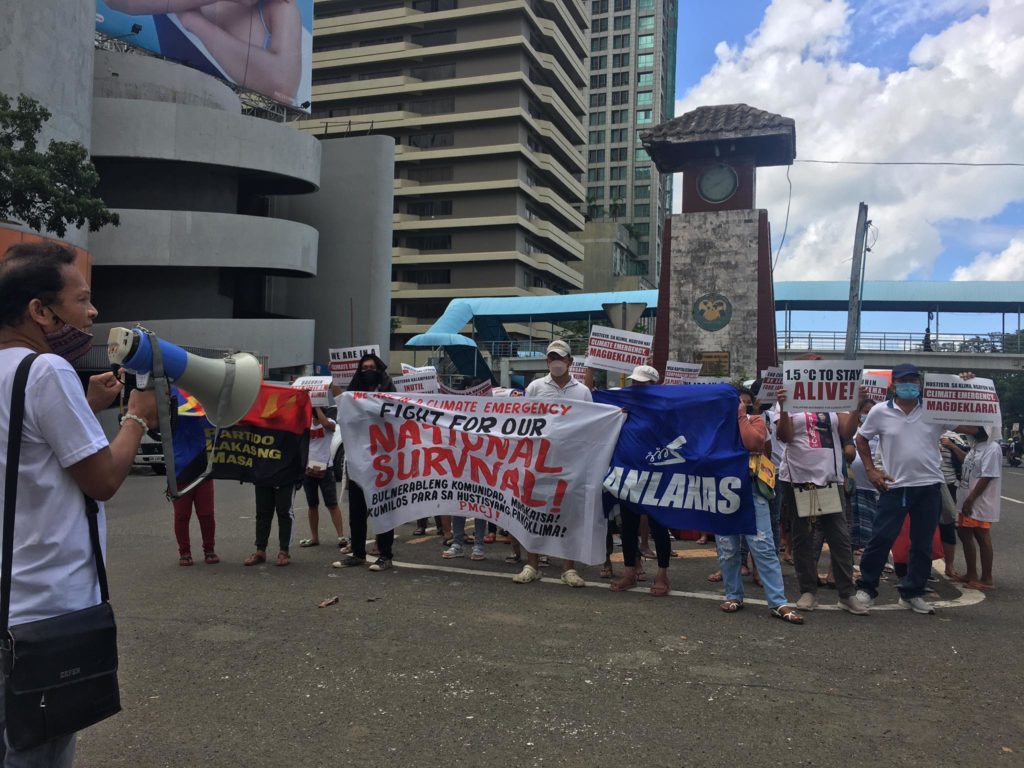 Members of the Philippine Movement for Climate Justice (PMCJ) Cebu during their Earth Day rally near the Fuente Osmeña rotunda in Cebu City.