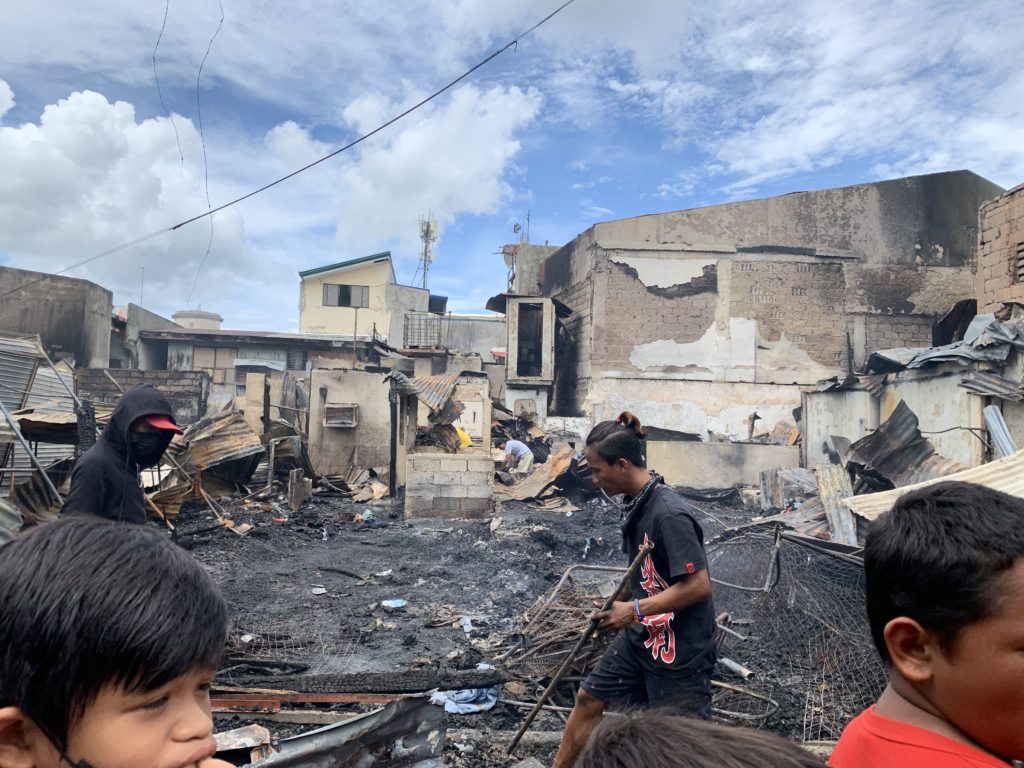 Residents try to salvage what they can among the ruins of their houses, which were destroyed by the dawn fire in Barangay Poblacion, Lapu-Lapu City. | Pegeen Maisie Sararaña