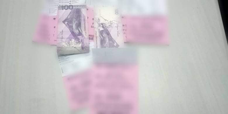 Here are the sample ballots of a local party - some of them stapled with P100 cash - that was confiscated from a Balamban resident in a checkpoint in Barangay Lusaran, Cebu City on May 7. | Contributed photo
