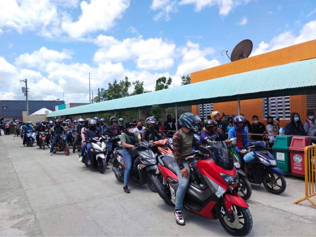 Passengers queue at the Tangil Port in Dumanjug town in southwestern Cebu as they wait for their turn to board their respective ships to take them to their hometowns. | Photo courtesy of CPA via Wenilyn Sabalo