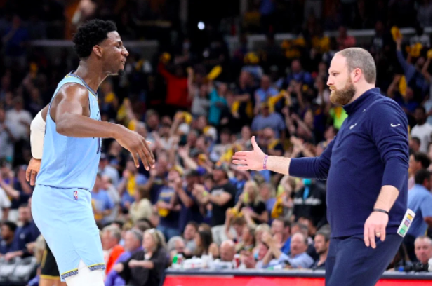 Jaren Jackson Jr. #13 of the Memphis Grizzlies celebrates a basket with head coach Taylor Jenkins against the Golden State Warriors during the third quarter in Game Five of the 2022 NBA Playoffs Western Conference Semifinals at FedExForum on May 11, 2022 in Memphis, Tennessee. Andy Lyons/Getty Images/AFP