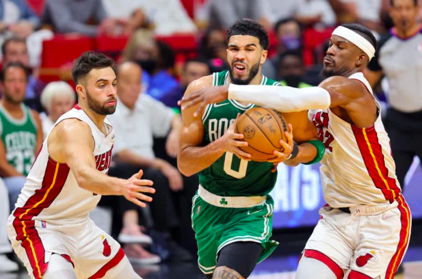 Jayson Tatum of the Boston Celtics drives to the basket against Max Strus and Jimmy Butler of the Miami Heat during the third quarter in Game Two of the 2022 NBA Playoffs Eastern Conference Finals at FTX Arena on May 19, 2022 in Miami, Florida. (Getty Images via AFP)