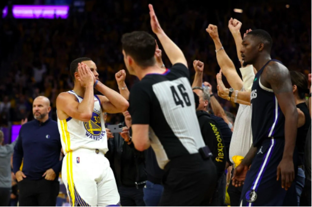  Stephen Curry #30 of the Golden State Warriors celebrates a three point basket in front of the Dallas Mavericks bench during the fourth quarter in Game Two of the 2022 NBA Playoffs Western Conference Finals at Chase Center on May 20, 2022 in San Francisco, California. Harry How/Getty Images/AFP