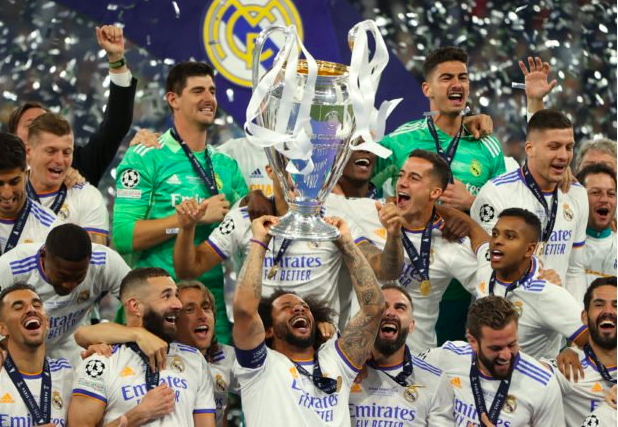 Real Madrid’s Marcelo celebrates winning the champions league with the trophy and teammates (REUTERS)
