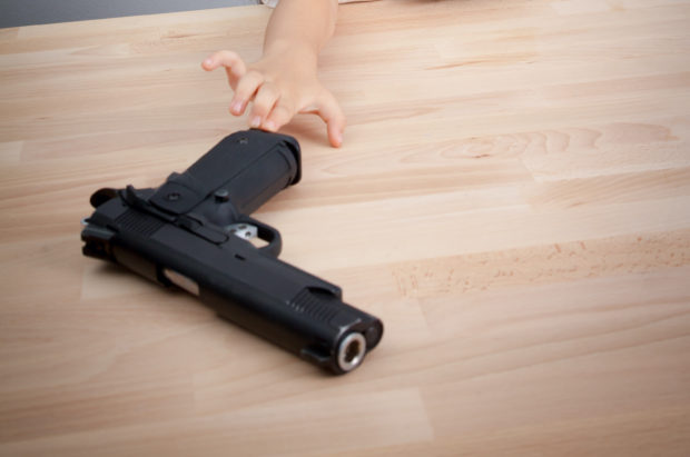 3-year-old with handgun 