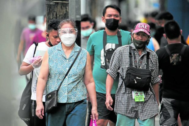 Photo of people wearing face masks for story:DOH recommends: Wear face mask until end of 2022