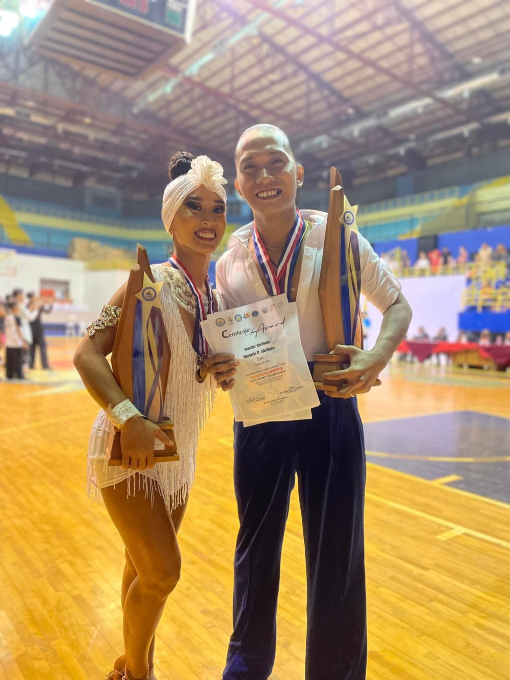 Dancesport couple wins. Marjorie Pasaje and Shardie Abellana showing the trophies they earned in the 2nd Philippine Open and Ninth GSYF Summerlympics Dancesports in General Santos City. | Photo from Pasaje's Facebook page