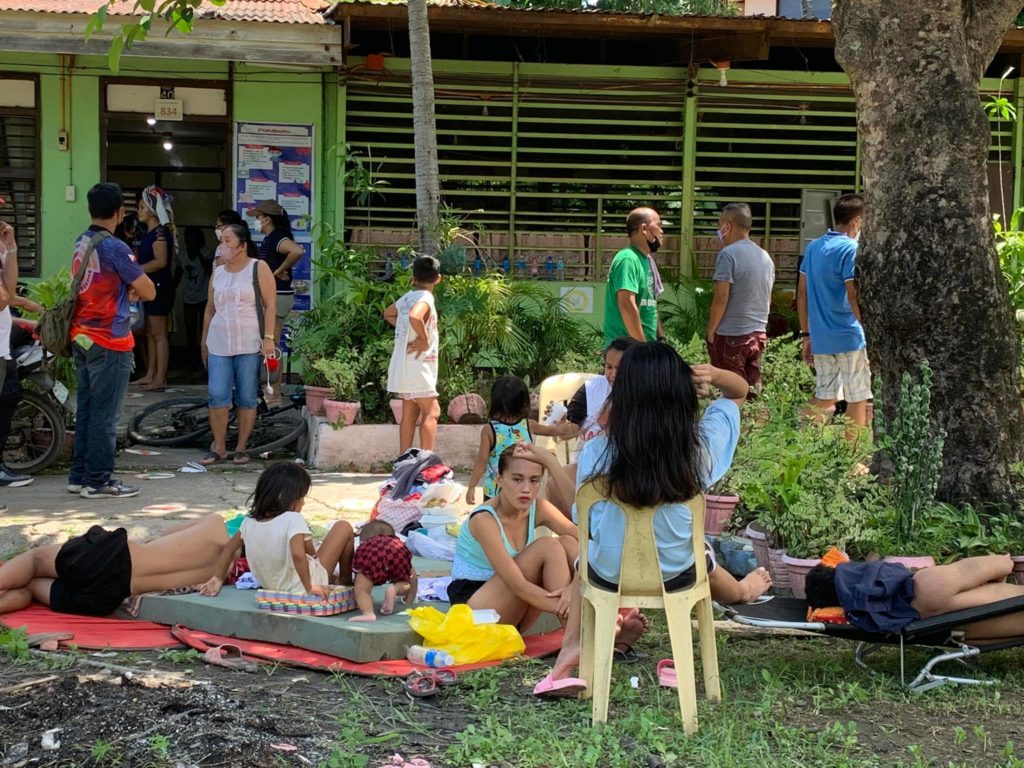 HOPE REMAINS FOR FIRE VICTIMS DESPITE THE CHALLENGE OF GETTING BACK TO THEIR FEET. Victims of the fire that razed several houses in five sitios of Punta Princesa, Cebu City on Saturday take temporary shelter in a school in the barangay. | Pegeen Maisie Sararaña