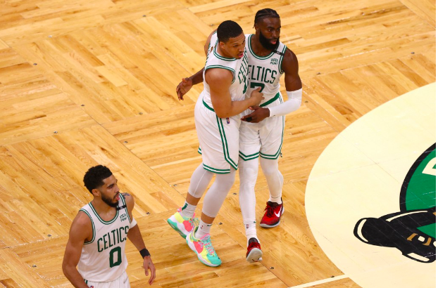 Grant Williams #12 of the Boston Celtics celebrates his three point basket with teammate Jaylen Brown #7 in the third quarter against the Golden State Warriors during Game Three of the 2022 NBA Finals at TD Garden on June 08, 2022 in Boston, Massachusetts. Elsa/Getty Images/AFP 