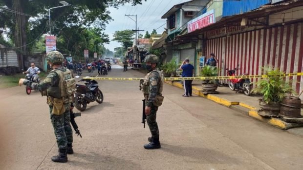 Police secure Lamitan City for story:Tighter security ordered in Lamitan, Basilan after killing of Ateneo gunman’s dad