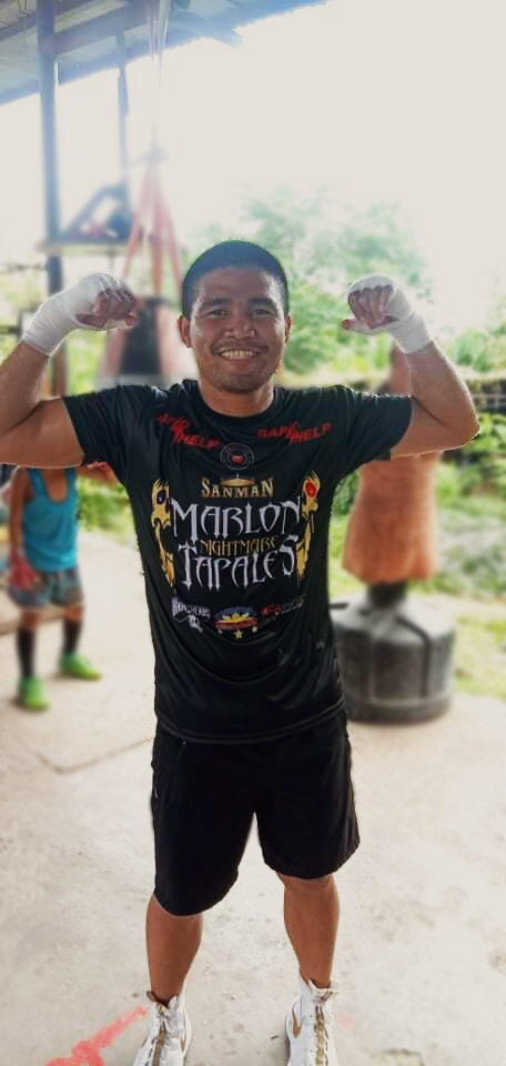 Marlon Tapales flexes his muscles for the camera while training at the Big Yellow Boxing Gym in Cebu. | Photo from Big Yellow Boxing Gym's Facebook page