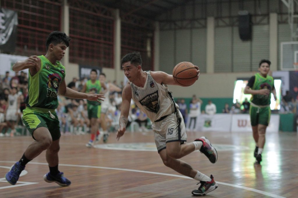 CONSOLACION SAROK WEAVERS WIN. Keaton Clyde Taburnal of Consolacion drives to the basket while being defended by a player from Bogo City in their PSL 21-U VisMin leg match in Talisay City. | Photo from the PSL Media Bureau.