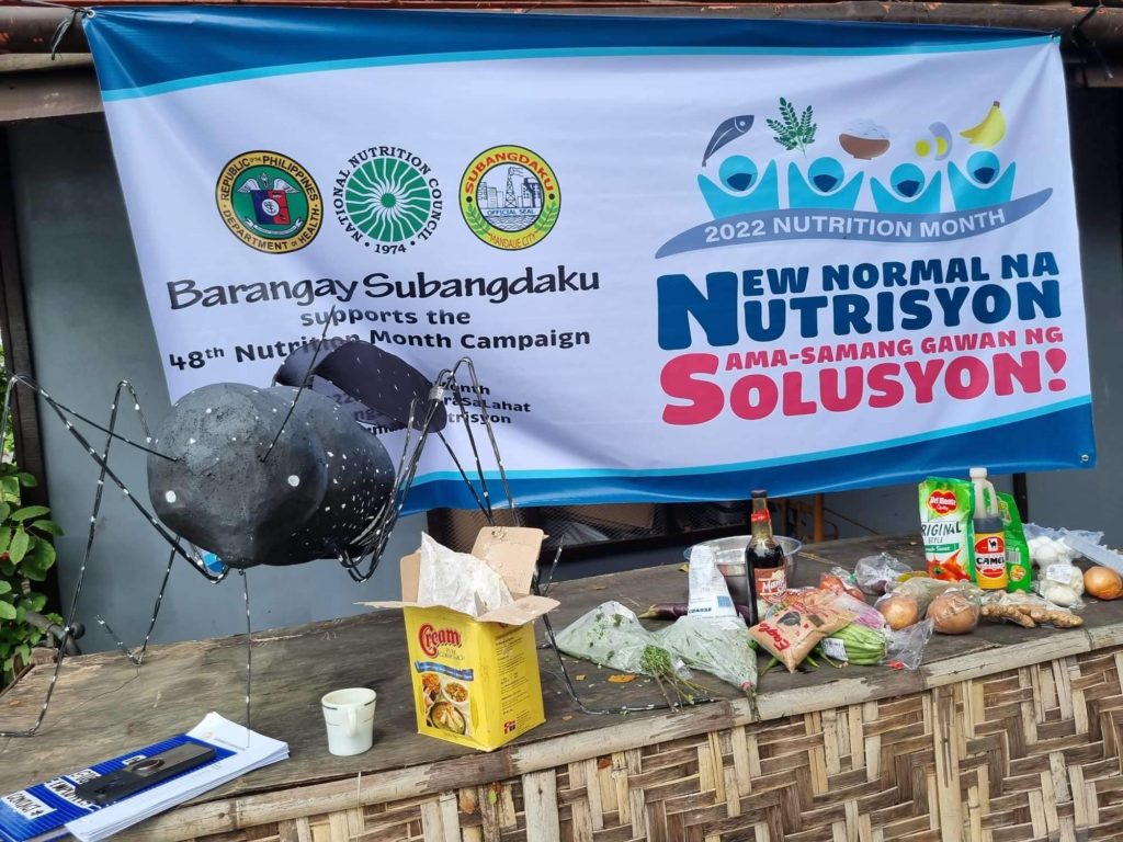 A streamer with the Nutrition Month motto of the Barangay Subangdaku officials is seen at the venue where the Nutrition Month celebration for the barangay kicks off. | Mary Rose Sagarino