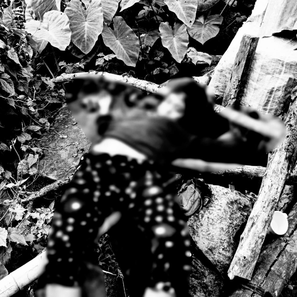 Photo of the body of Nikka dela Cruz for story:Group condemns killing of Cebuana activist turned 'red fighter' in NegOcc