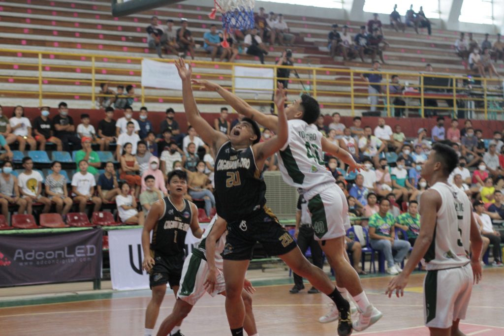 KINGFISHERS WIN. Rich Rafael Porcadilla (20) of Cagayan de Oro is fouled hard by Bogo City's Adrian Jay Tonacao during their PSL 21U match at the Don Celestino Martinez Sr. Sports and Cultural Center in Bogo City, north Cebu, on Thursday, July 14, 2022. | Photo from the PSL Media Bureau.