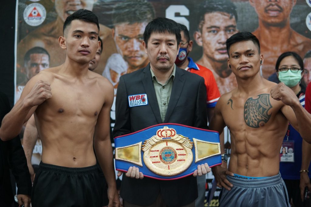 Jhunrick Carcedo (left) and Antonio Siesmundo (right) flanks WBF supervisor Alvin S. Go holding the WBF Asia Pacific super lightweight title during the weigh-in of their main event duel in Kumong Bol-Anon VI on Saturday in Tagbilaran City, Bohol. | Photo from PMI BoxinG Stable Facebook page