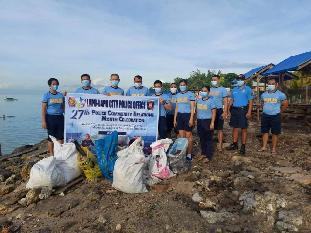 Lapu-Lapu City policemen conduct a coastal cleanup and scubasurero drive on Friday, July 15, where they have collected nearly 200 kilos of garbage. | Contributed photo