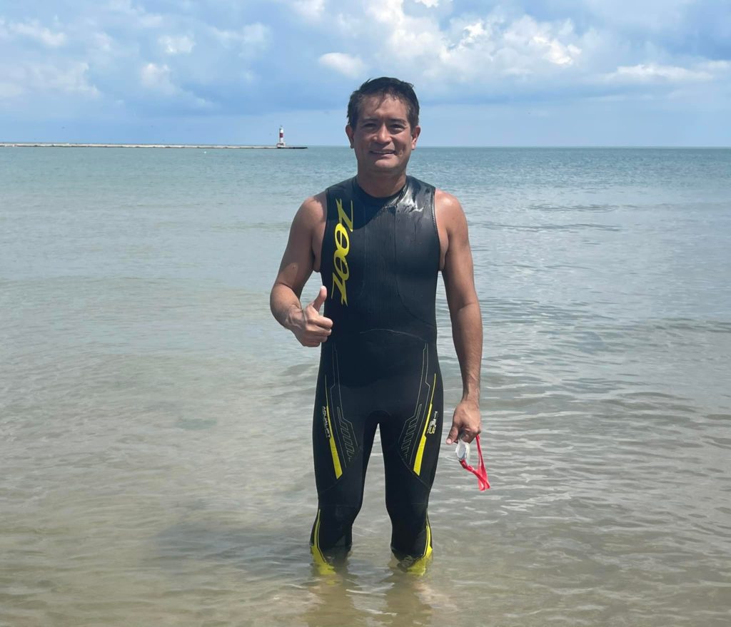 PINOY AQUAMAN CONQUERS LAKE MICHIGAN. Accomplished open-water swimmer, prosecutor and environmentalist Ingemar Macarine gives a thumbs up after crossing Lake Michigan in a a 5 kilometer open water swim. | Photo from Macarine's Facebook page