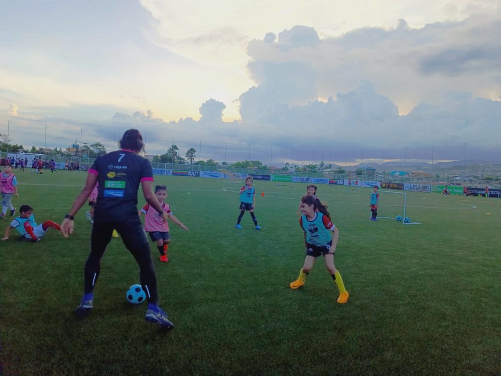 GENTLE GIANTS FOOTBALL ACADEMY. Cebu FC's goalkeeper Ace Villanueva helps train the young participants of their club's football academy. | Photo by Glendale Rosal