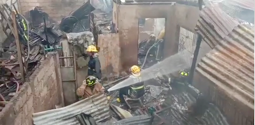 Firefighters continue to battle the fire on July 7 at Sitio Sto. Niño which was placed under control at 12:04 and was declared fire out at 12:21 p.m. | screen grab from Paul Lauro's video