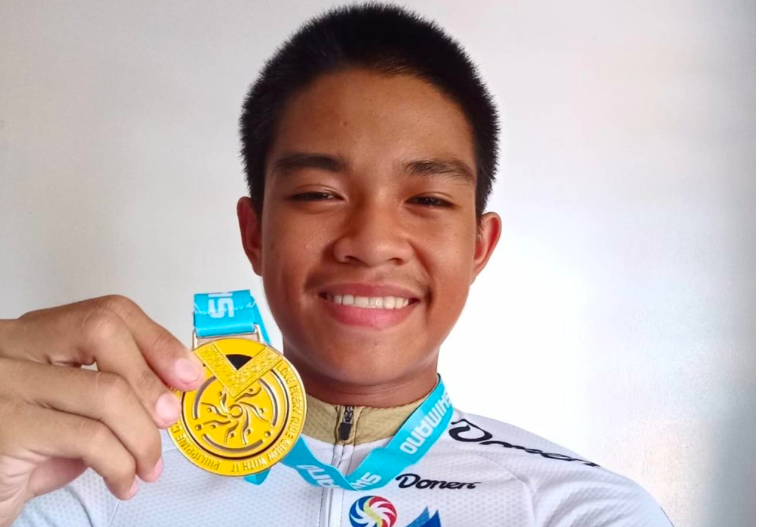 Dwight Santos wearing the coveted Go For Gold jersey with the medal he won last June in Pampanga. | Contributed Photo