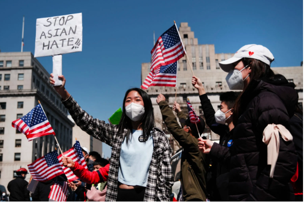 FILE PHOTO: People participate in a protest to demand an end to anti-Asian violence on April 04, 2021, in New York City. Spencer Platt/Getty Images/AFP