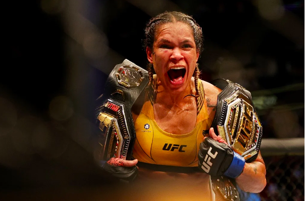 Amanda Nunes of Brazil celebrates after defeating Julianna Pena in their bantamweight title bout during UFC 277 at American Airlines Center on July 30, 2022 in Dallas, Texas. Amanda Nunes won via unanimous decision. Carmen Mandato/Getty Images/AFP