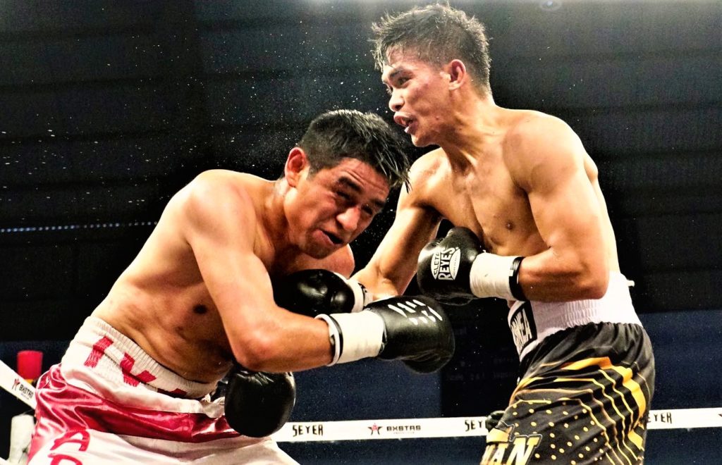 Jade Bornea (right) hits Ivan Meneses Flores (left) with a right hook during their non-title bout in Mexico. | Photo from BXSTRS Facebook page.