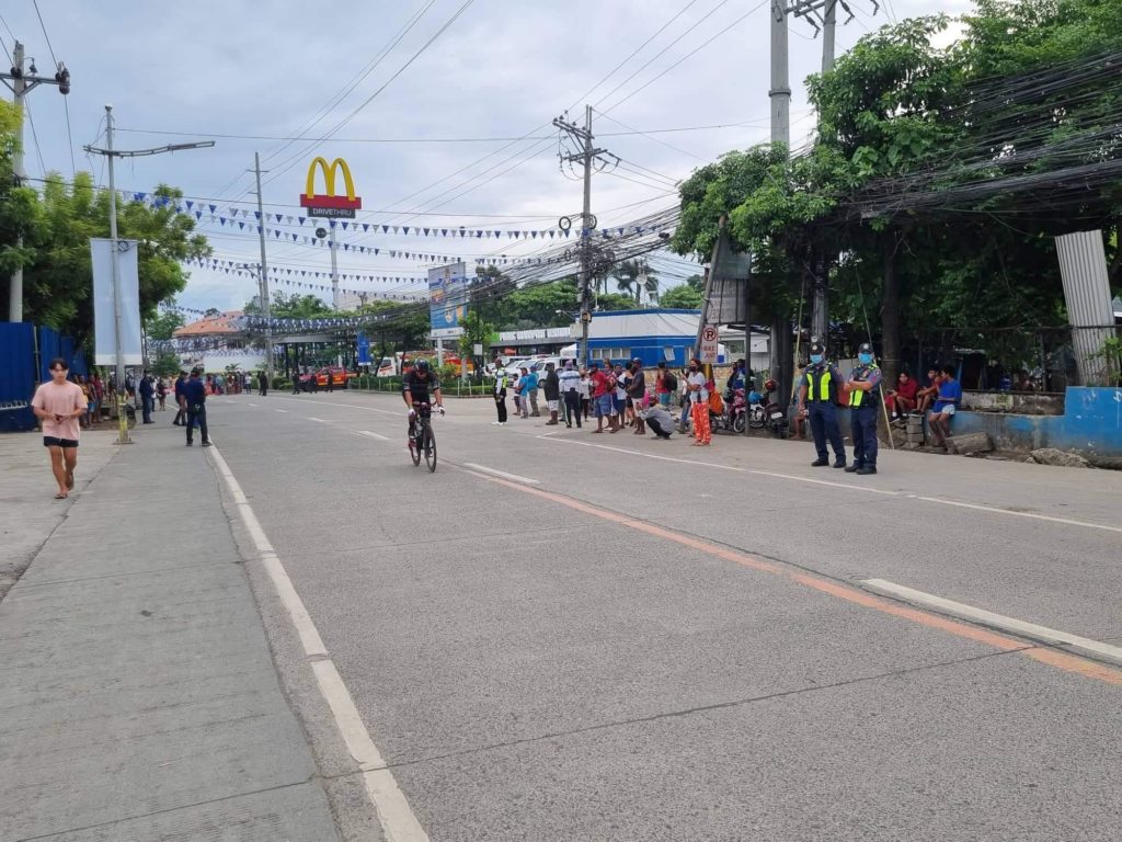 A race contestant of the Ironman 70.3 pedals his way to the South Road Properties in Cebu City which is one of the race routes of the bike segment of the competition. | Pegeen Maisie Sararaña