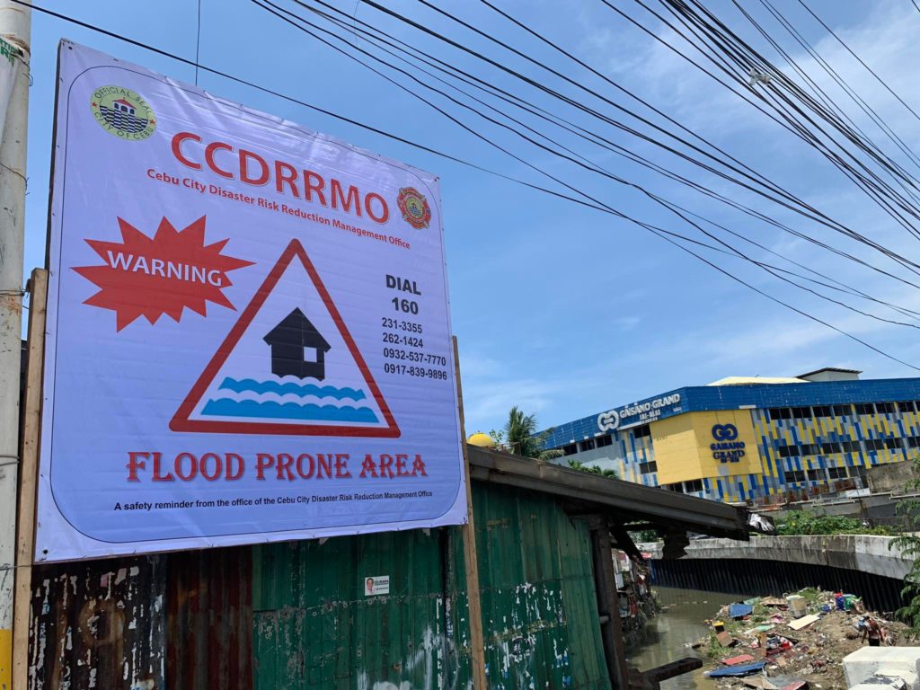 ISOLATION DUE TO COVID. This was Mayor Rama's response to critics of his absence during last week's floods in the city. In photo is the Cebu City Disaster Risk Reduction and Management Office (CCDRRMO) placing a warning sign on a flood-prone area in the city. | Morexette Marie B. Erram