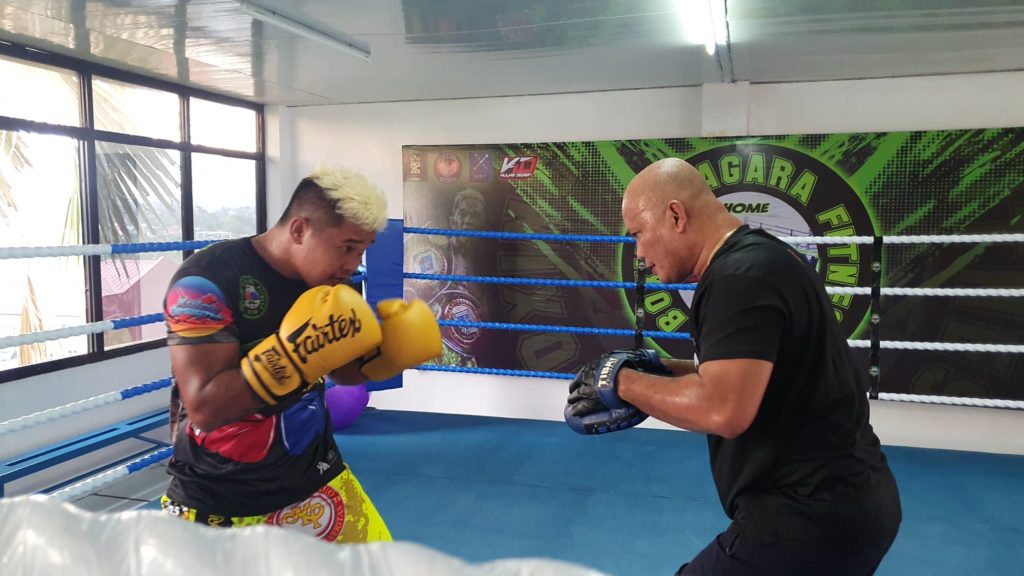 Albert Pagara hits the mitts with Edmund Villamor at the Pagara Boxing Gym. | Contributed photo
