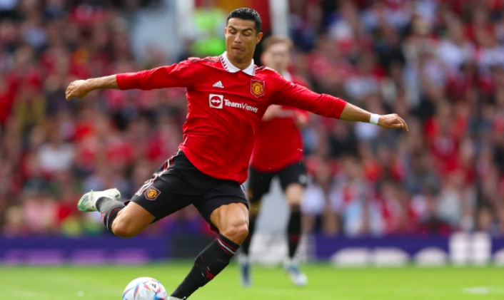 Manchester United’s Portuguese striker Cristiano Ronaldo passes the ball during a pre-season club friendly football match between Manchester United and Rayo Vallecano at Old Trafford in Manchester, north west England, on July 31, 2022. (Photo by Nigel Roddis / AFP)