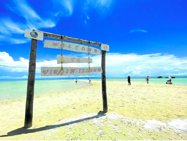 A group of tourists visits Virgin Island in Panglao, Bohol province, to enjoy the clear waters surrounding the now pristine sandbar, where makeshift food stalls used to stand. —LEO UDTOHAN