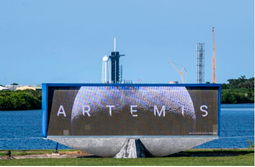 Launch Pad Complex 39B is seen behind a screen displaying NASA’s Artemis I Moon logo at Kennedy Space Center, in Cape Canaveral, Florida, on August 16, 2022. AFP