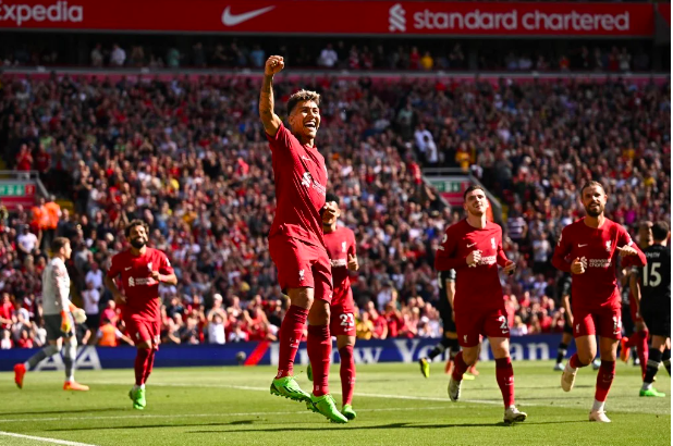 Liverpool’s Brazilian striker Roberto Firmino (C) celebrates after scoring their fourth goal during the English Premier League football match between Liverpool and Bournemouth at Anfield in Liverpool, north west England on August 27, 2022. (Photo by Oli SCARFF / AFP)