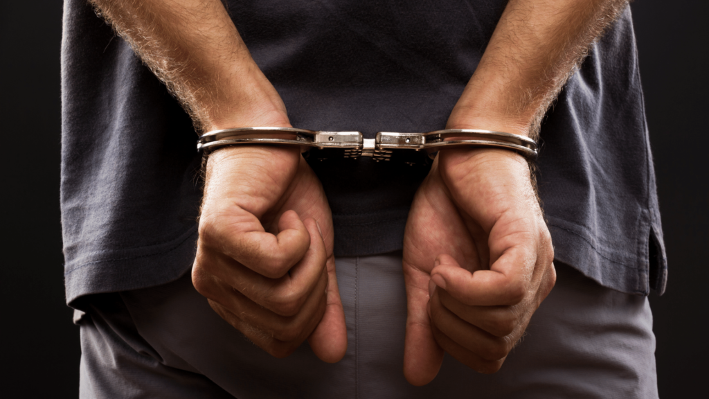 Man, who needed money to win back live-in partner, robs 16-year-old student, gets caught by Cebu City residents. In photo are handcuffs on man stock photo