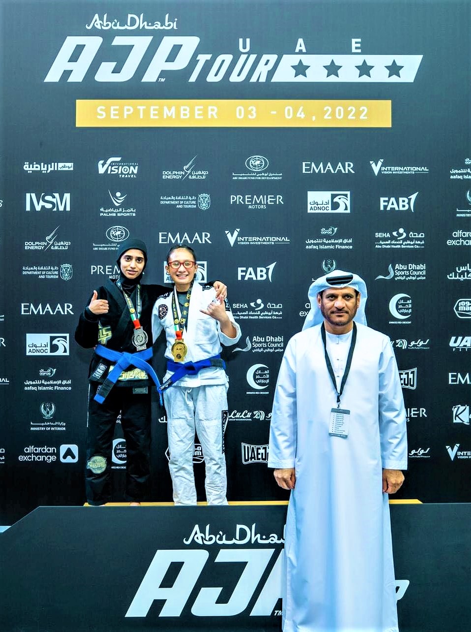 Cebuana wins Jiu Jitsu gold in AJP Tour UAE. Eliecha Zoe Malilay (white gi) poses with her opponent, Rauda Nasser Alshamsi (black gi) of UAE during the awarding ceremony of the Abu Dhabi Jiu-Jitsu Pro (AJP) Tour UAE National Pro Gi. | Contributed Photo