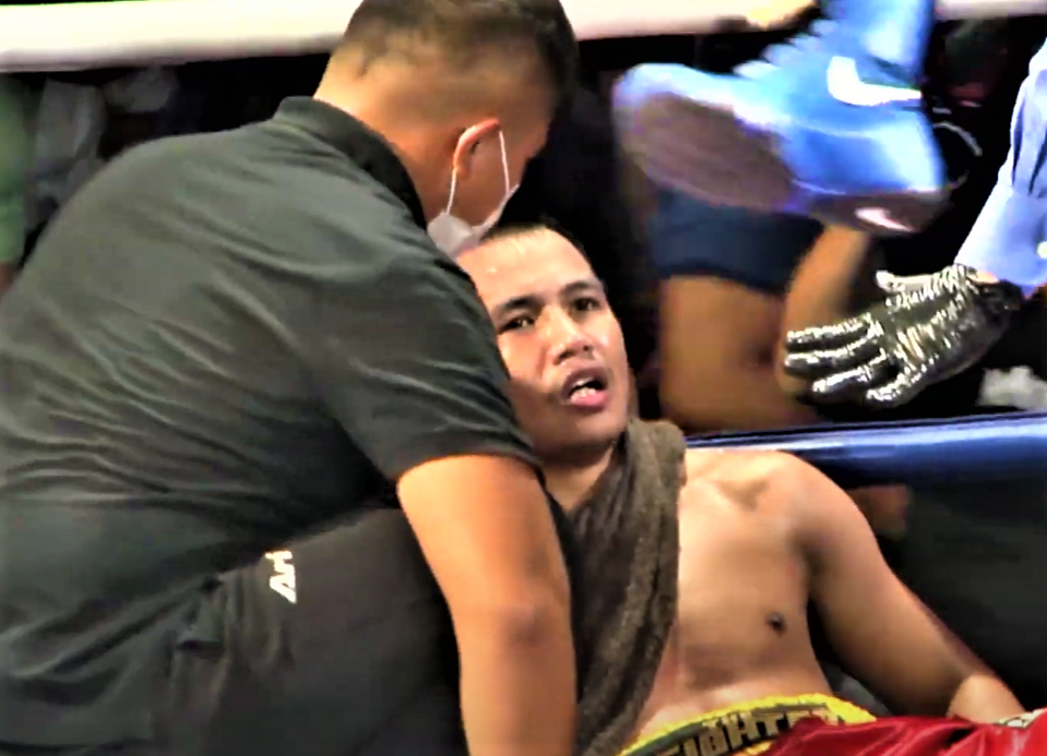 Thailand's Arnon Yupang is being helped by his cornerman after getting knocked out in the third round of his bout against Virgel Vitor. | Screen grab from the live stream
