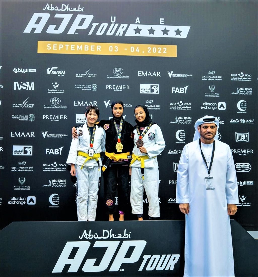 Ellise Xoe Malilay (left) poses with the winning BJJ athletes during the awarding ceremony. | Contributed photo