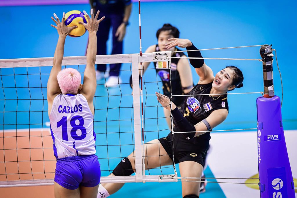 Creamline Philippines loses to Thailand in three sets. Tots Carlos blocks a smash from a Thai player during their 2nd ASEAN Grand Prix Women’s Volleyball Invitation match in Thailand. | Photo from PNVF