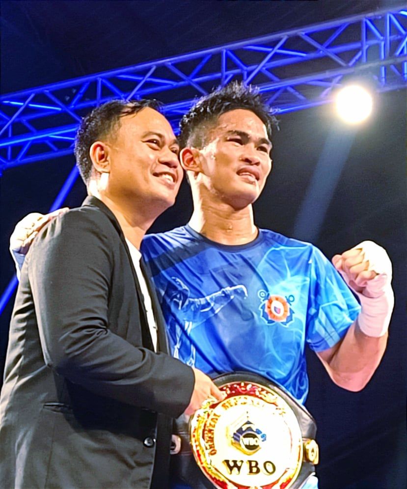 PMI Bohol Boxing Promotions promoter and manager Floriezyl Echavez Podot (left) poses with WBO Oriental super featherweight champion Virgel Vitor during Kumong Bol-Anon 7 in Dimiao, Bohol last September 9, 2022. | Glendale Rosal