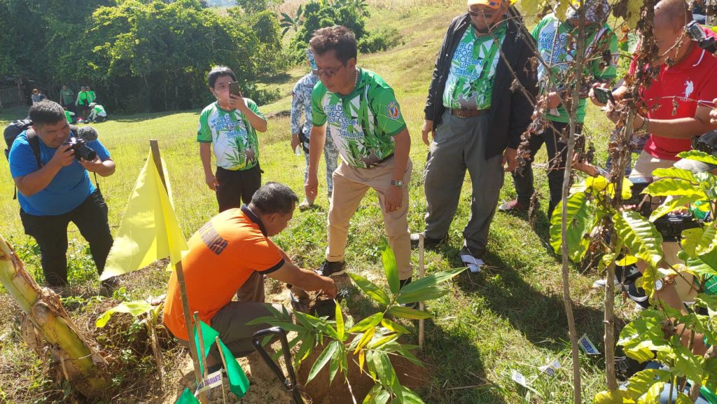 Tuburan Mayor Democrito "Aljun" Diamante leads the ceremonial planting of bamboo seedling in Barangay Kabangkalan, Tuburan town during the celebration of the World Bamboo and Cleanup Day on Sept. 17. | Contributed photo