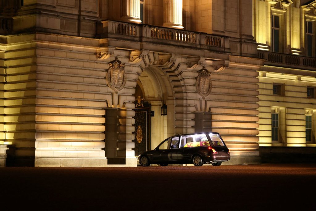 Queen's coffin arrives at Buckingham Palace as huge crowds line London route