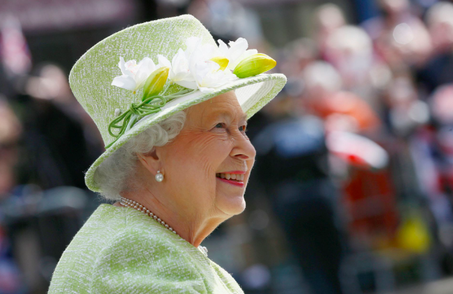 Britain's Queen Elizabeth smiles as she greets well wishers on her 90th birthday during a walkabout in Windsor, west of London, Britain April 21, 2016. REUTERS/Stefan Wermuth/File Photo