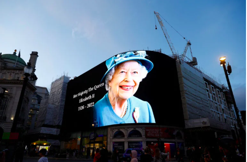 An image of Queen Elizabeth, Britain’s longest-reigning monarch and the nation’s figurehead for seven decades is seen at Piccadilly Circus after she died aged 96, according to Buckingham Palace, in London, Britain September 8, 2022. REUTERS