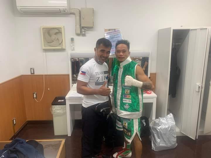 Esneth Domingo and his trainer and uncle Michael Domingo pose for the camera after scoring a TKO against Jukiya Iimura of Japan. | Photo from Domingo's Facebook page