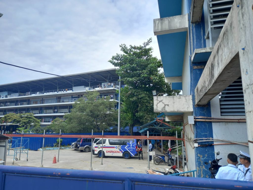 Emergency responders of the Mandaue City Disaster Risk Reduction and Management Office are among the first to respond to the school where a student died after he fell from the school's upper floors. | Mary Rose Sagarino