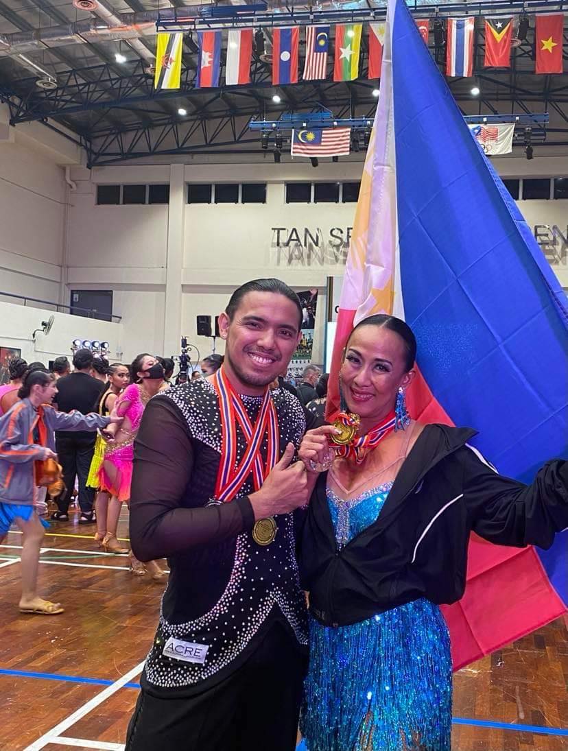 Hayco, Dancesport Team Cebu City bag 6 gold medals in Singapore competition. Anselmo Estillore Jr. (left) and Eleanor Hayco (right) show the gold medal they have won in the LKDSA Open Dancesport Championship in Kuala Lumpur, Malaysia on Saturday, October 8, 2022.  | Contributed Photo
